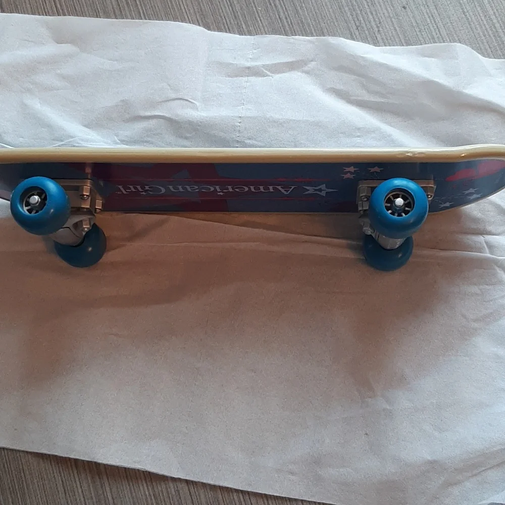American Girl Skateboard with Blue Wheels